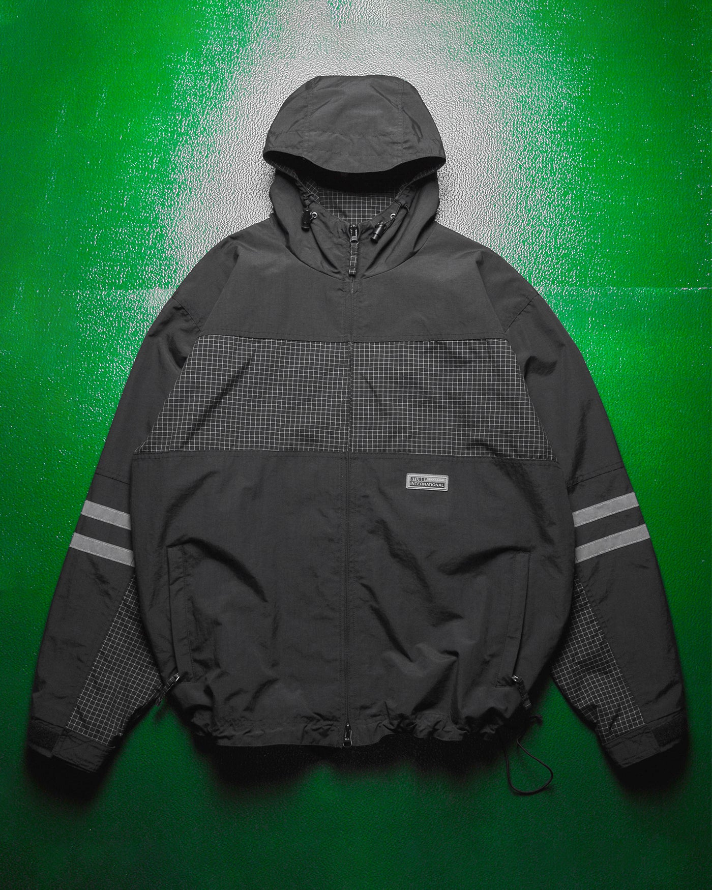 International Grid  Reflective Panelled  Shell Jacket (M)
