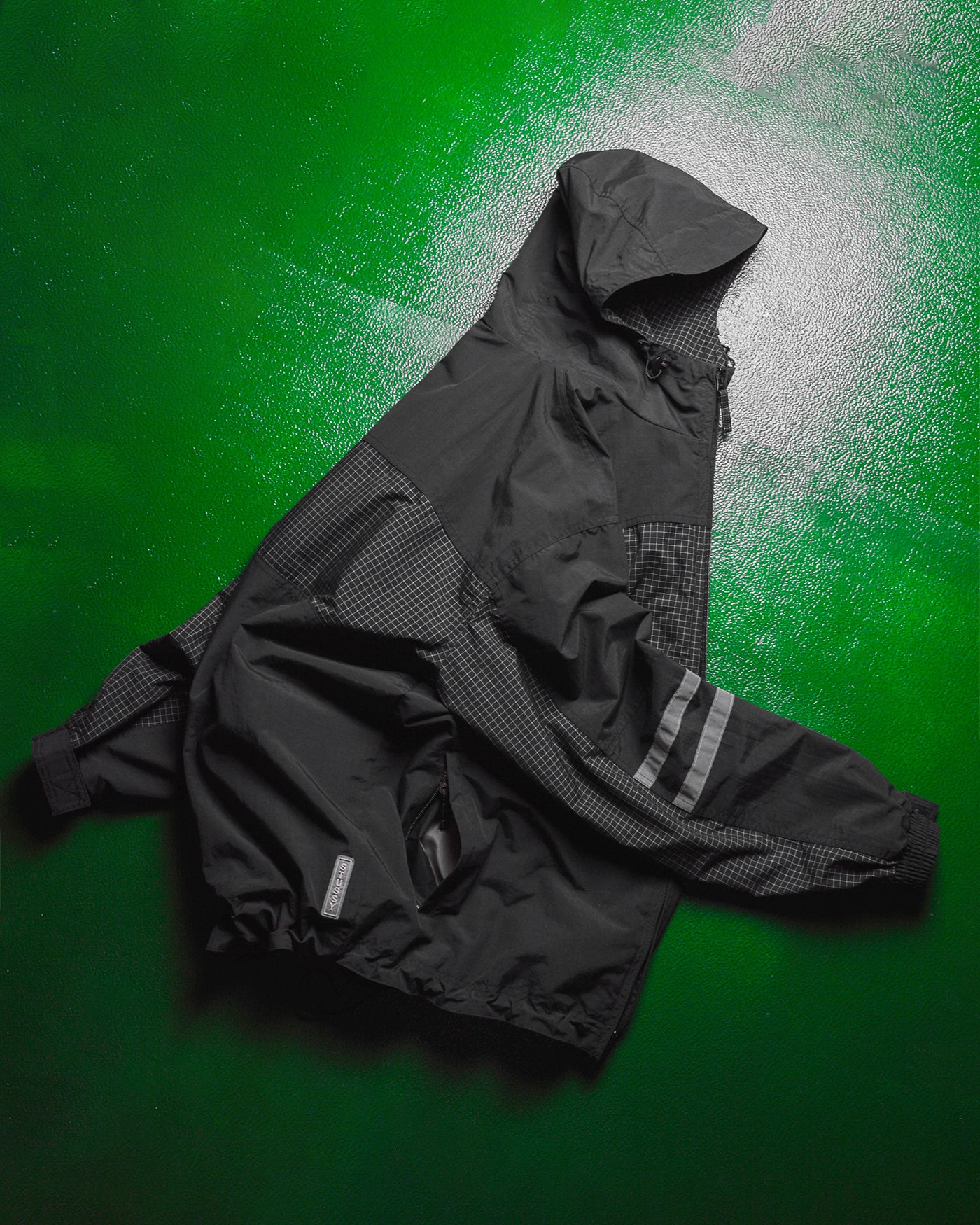 International Grid  Reflective Panelled  Shell Jacket (M)