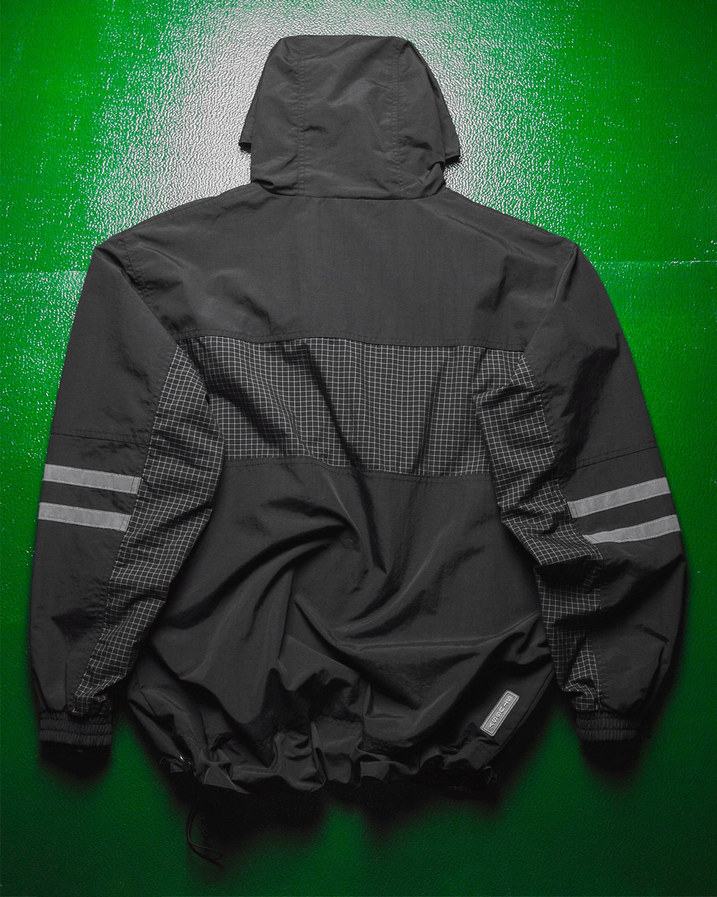International Grid  Reflective Panelled  Shell Jacket (M)